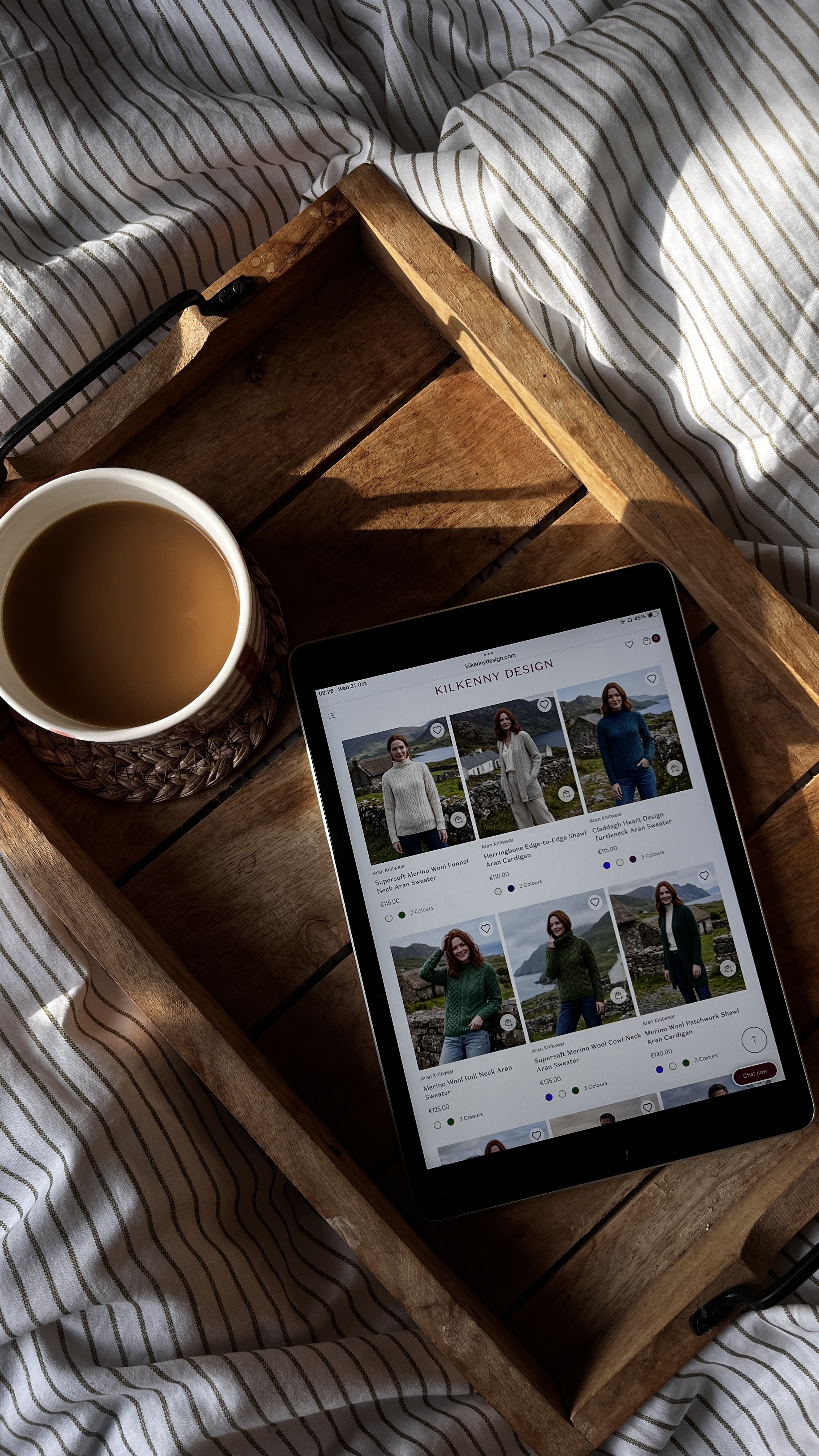 overhead shot of kilkenny design irish gifts on a tablet with a cup of tea on a tray 